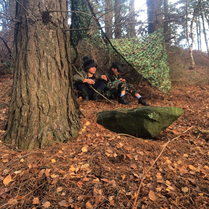 Camo net den building